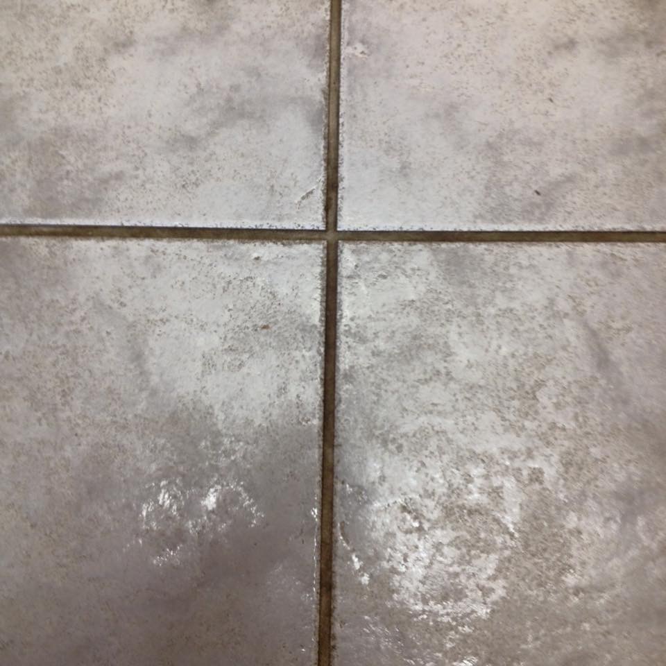 Darker stained grout lines before restoration