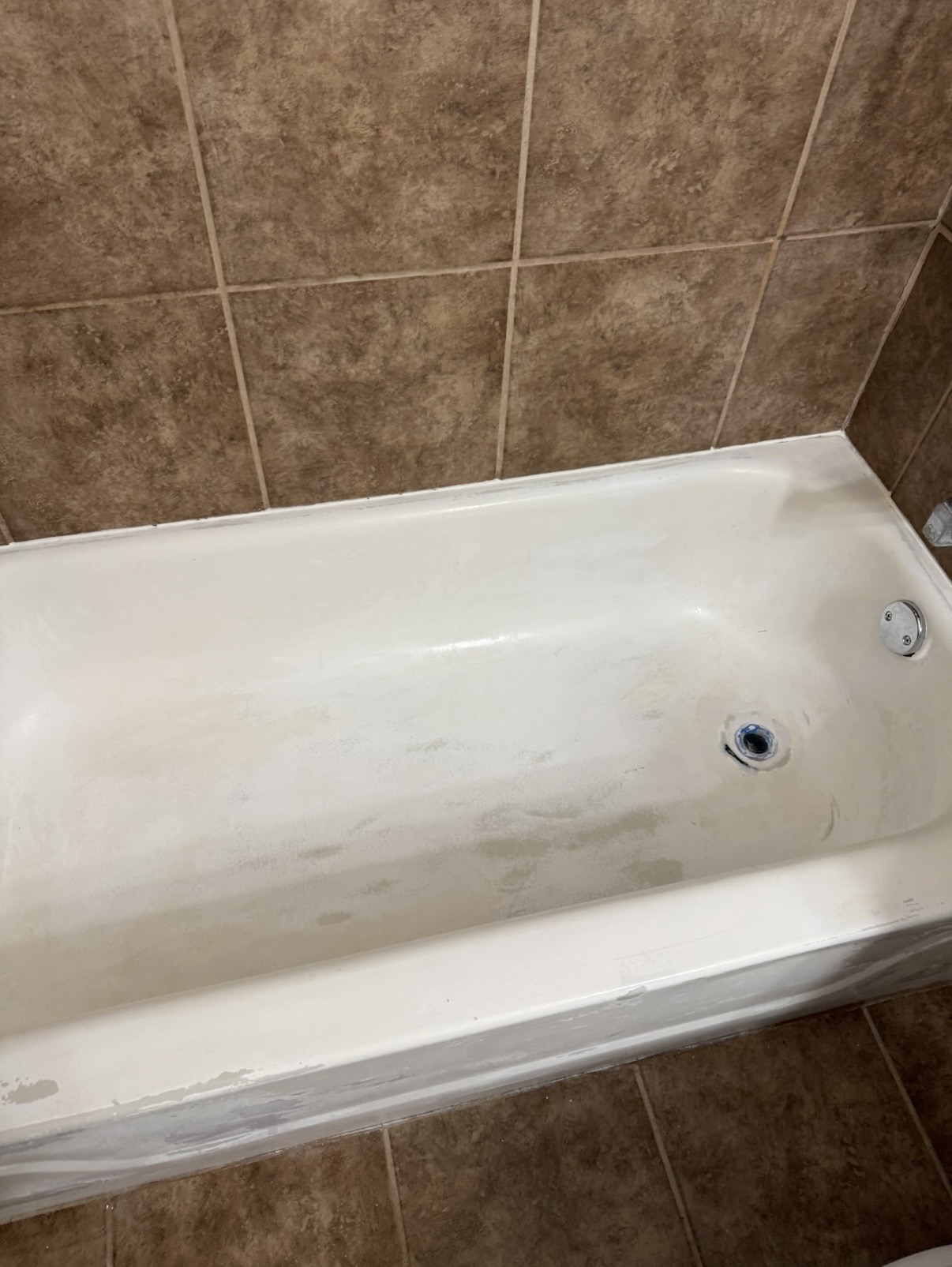 Worn, stained bathtub before refinishing